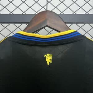 Detail of the Manchester United 2025/2026 third jersey – logo and fabric texture