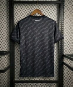 Black patterned shirt hanging on rack
