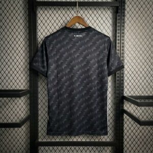Black patterned shirt hanging on rack